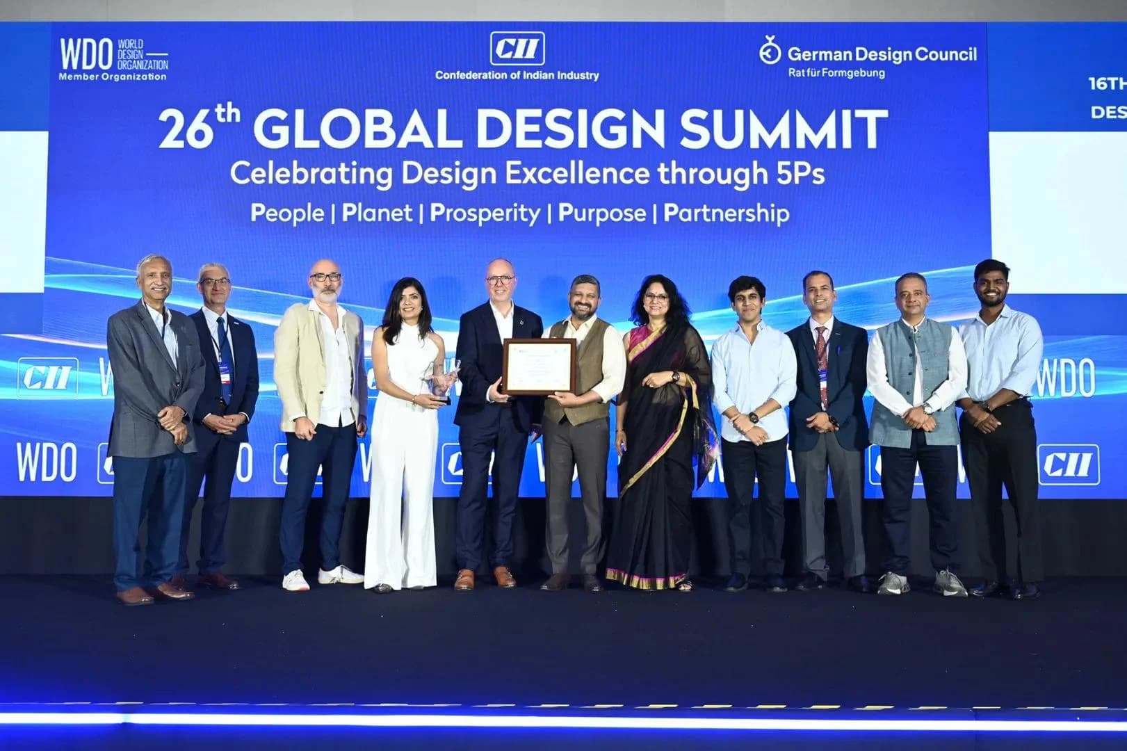 The Yoxa.ai team on stage receiving an award at the 26th CII Global Design Summit